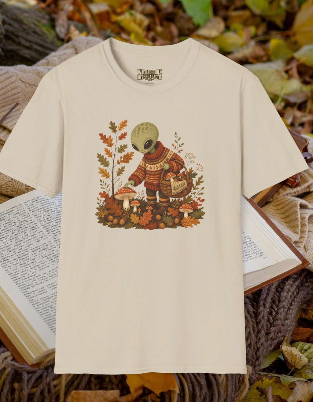 Alien Harvest T‑Shirt — Cute Space Creature in Cozy Sweater Picking Mushrooms (Fall Graphic)