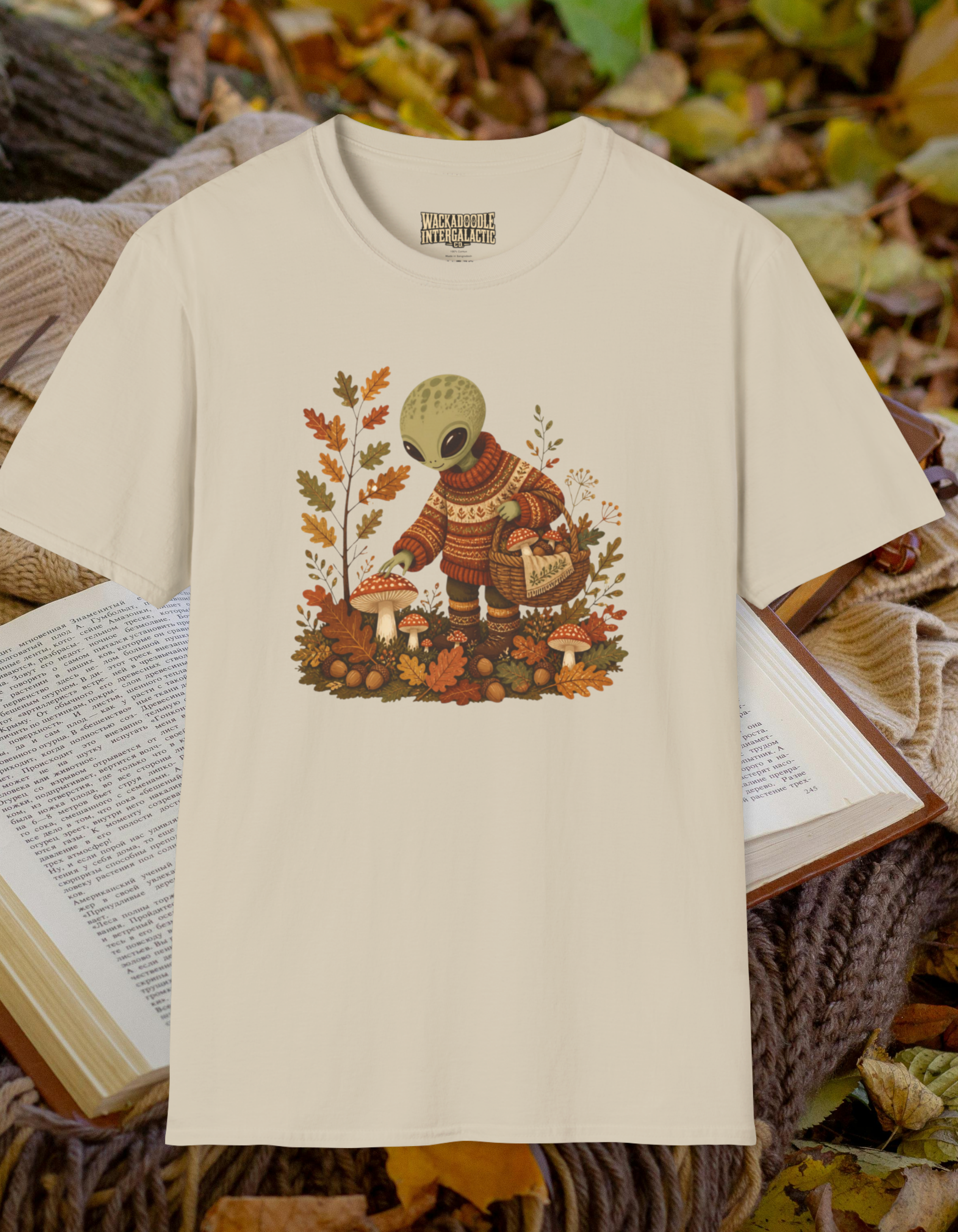 Alien Harvest T‑Shirt — Cute Space Creature in Cozy Sweater Picking Mushrooms (Fall Graphic)