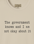 Statement T-Shirt — “The government knows and I am not okay about it” Tee
